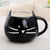 Cat-shaped white/black coffee mug